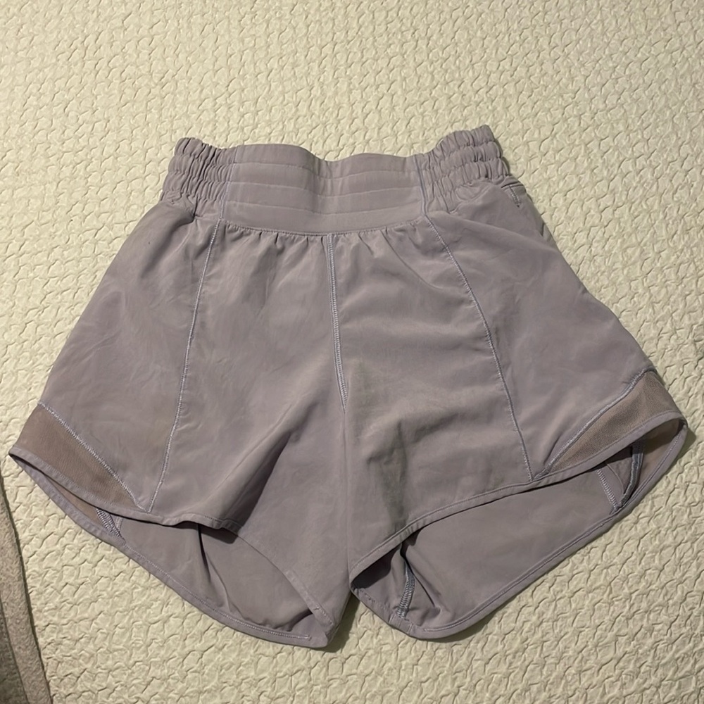 Only worn a couple times 4 inch high-rise size 2 purple Lululemon shorts